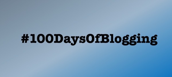 The words "100 Days Of Blogging" on a gray / blue background